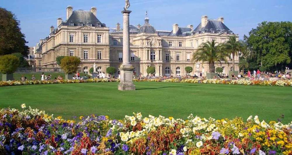 Luxembourg Gardens with flowers and palace.